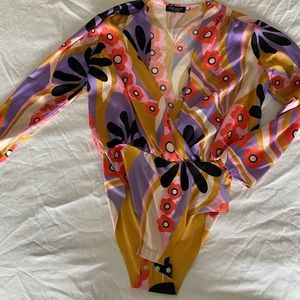 Buttery material with floral print. No front closure. Purchased from Zara